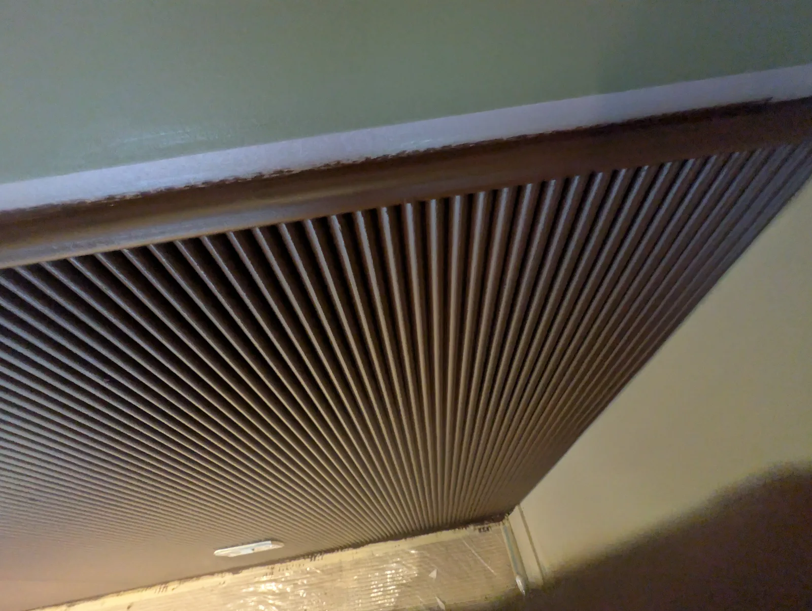 Close-up of the sprayed fluted panelling showing the even, consistent finish across the ribbed profile